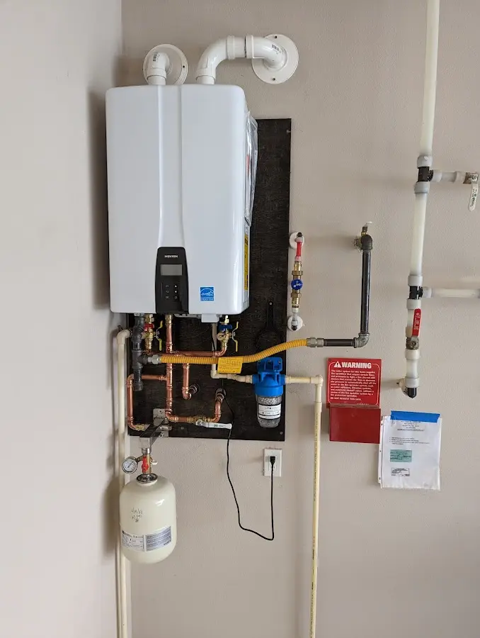 Professional plumber installing copper piping in a Picture Rocks home